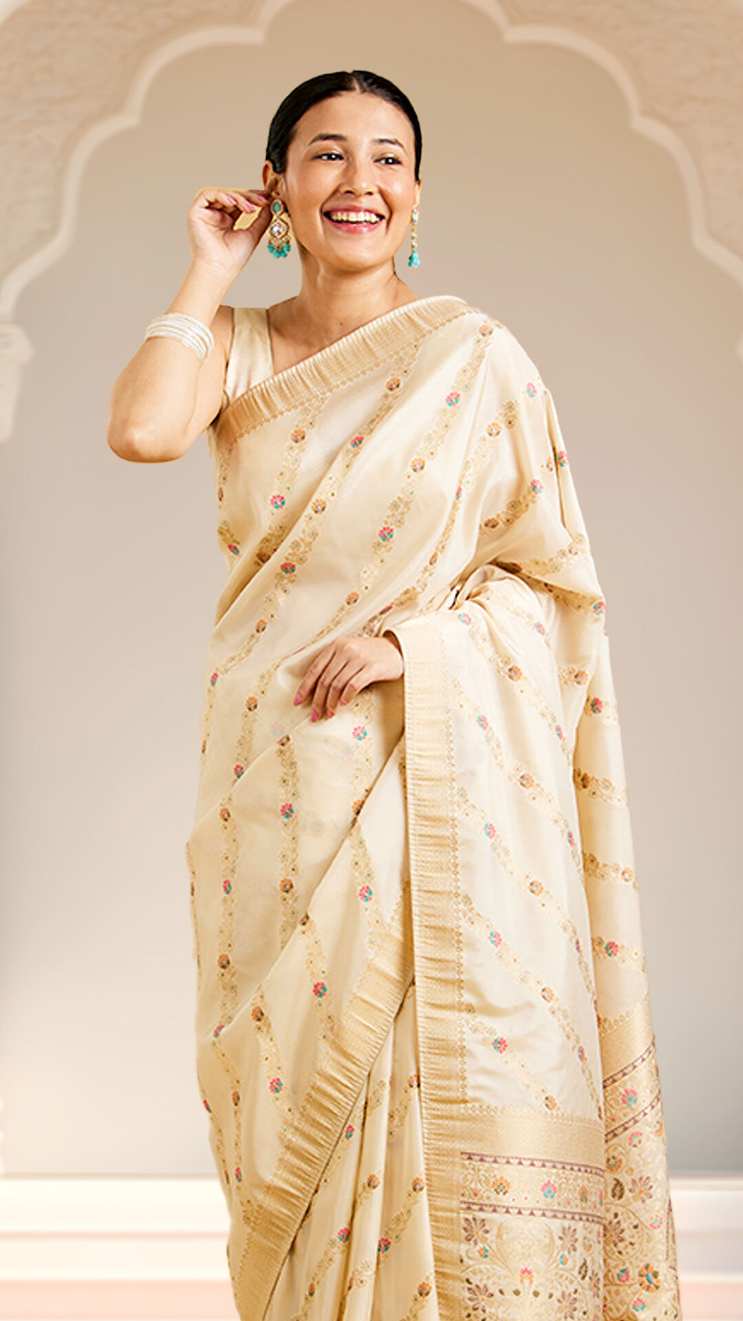 Woman wearing a printed cream saree